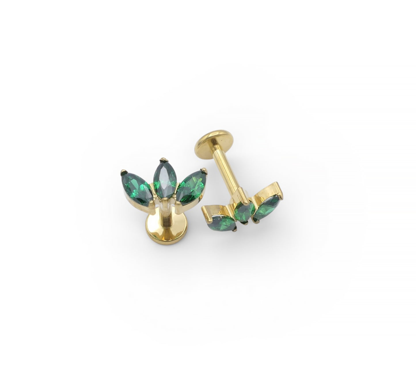 Gold earrings with green gemstones on a white background
