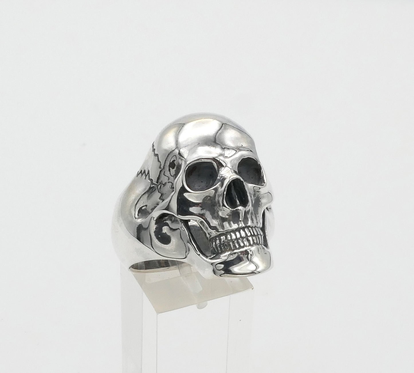 Silver skull ring on a white background