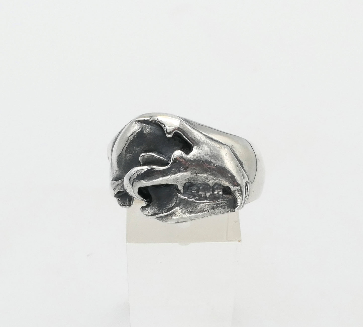 Silver bear skull ring with a unique design on a white background