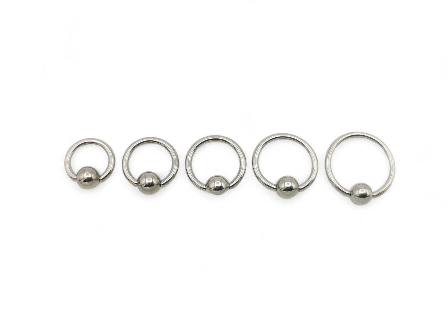 A polished titanium BCR with a high polished finish, designed for 1.2mm/16g piercings, featuring a ball closure mechanism.
