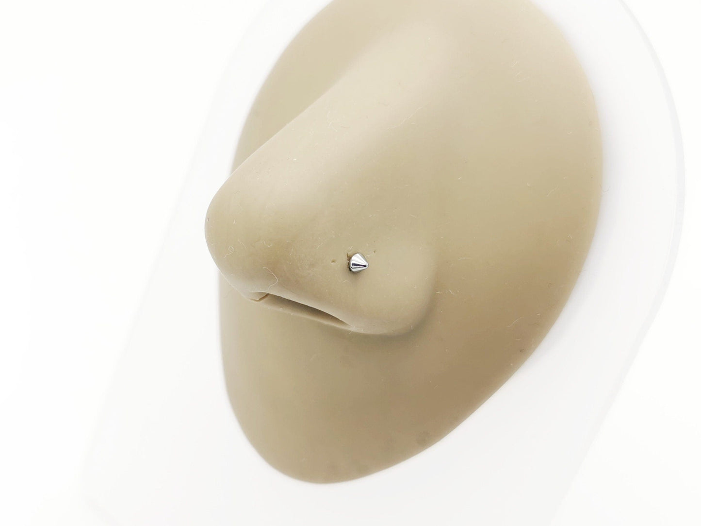 Titanium Spike Nose Stud on a nose