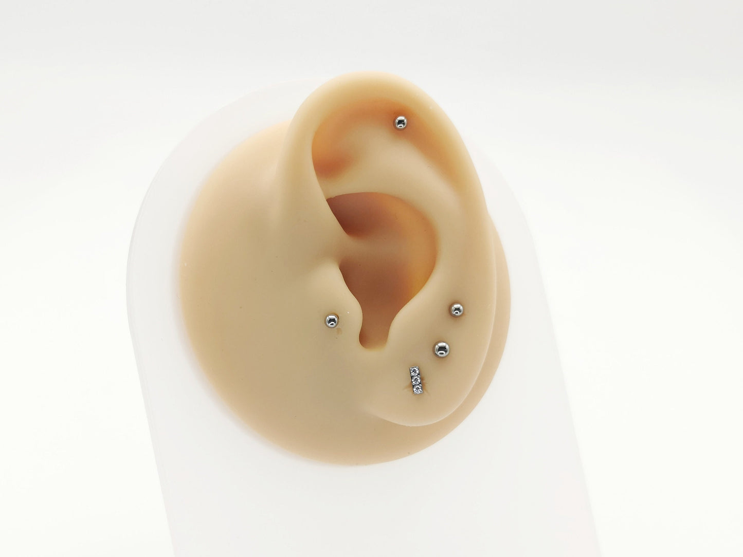 Titanium threadless jewelled baguette stud on a mannequin ear