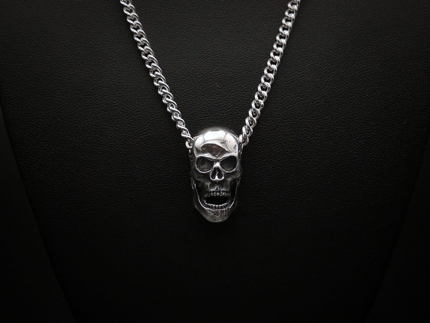 Large silver skull pendant necklace with silver curb chain