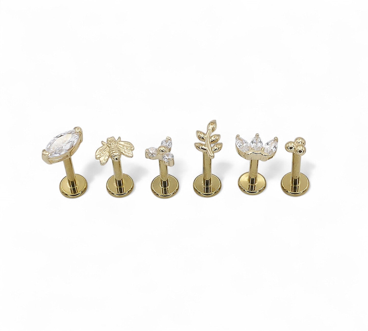 Gold titanium jewelled and fancy studs 