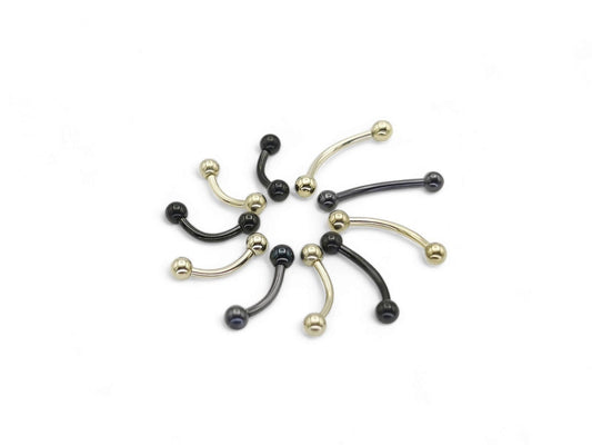 A black or gold titanium curved barbell, externally threaded for piercings, with a screw-fit ball.