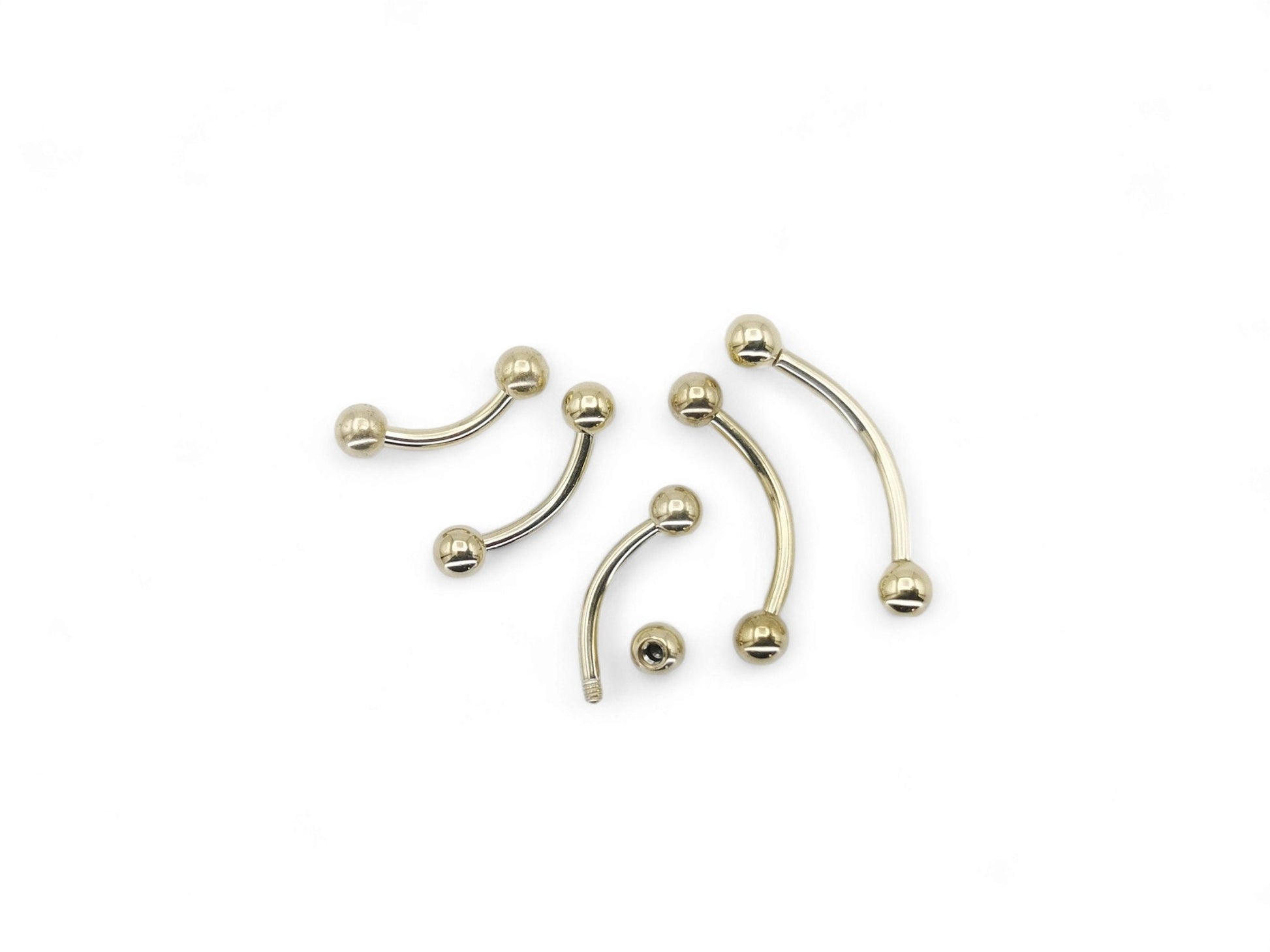 A black or gold titanium curved barbell, externally threaded for piercings, with a screw-fit ball.