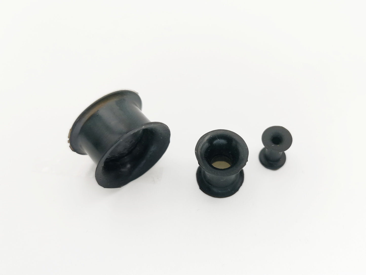 Black silicon ear tunnel on a white background