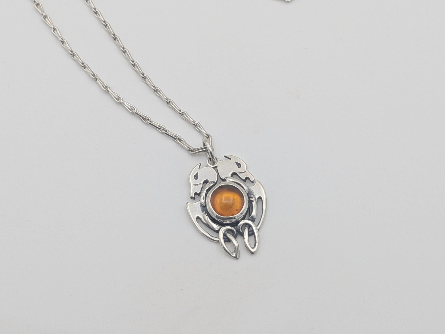 Handmade Sterling Silver Celtic Dog Pendant with Amber – Crafted in Our Workshop
