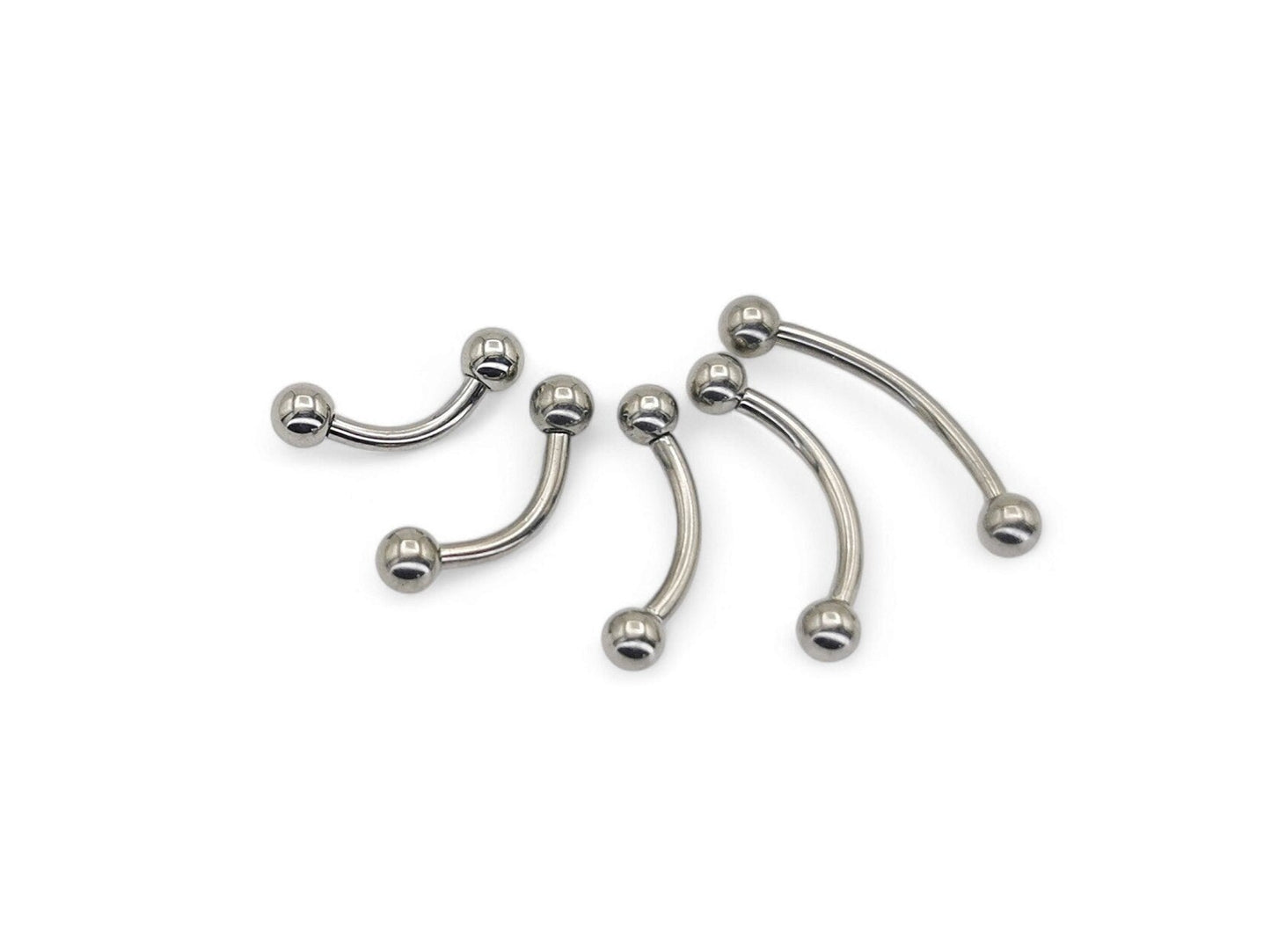 A collection of titanium curved barbells with screw fit balls, varying in length, on a white background.