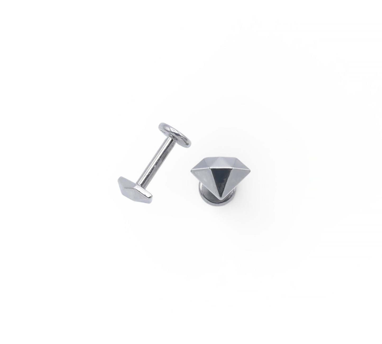 Silver stud earrings on a white background