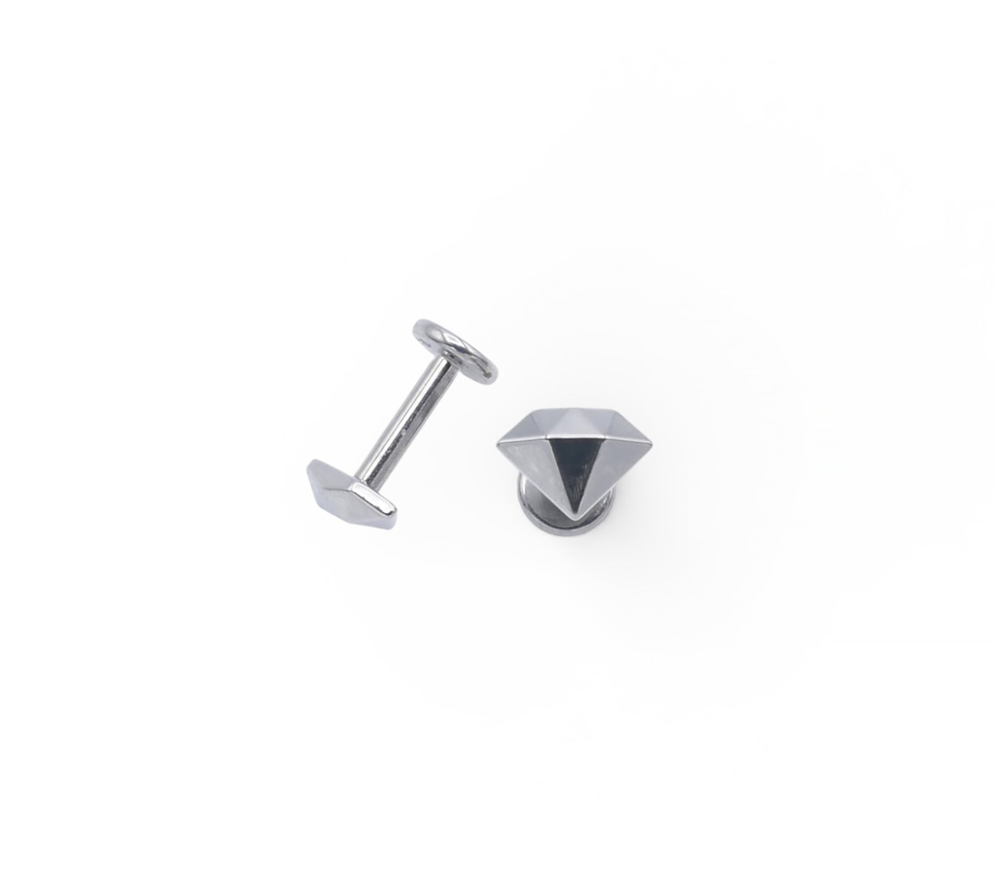 Silver stud earrings on a white background