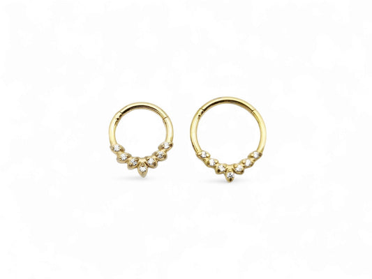 Gold surgical steel jewelled laurel clicker ring with cubic zirconias on a white background