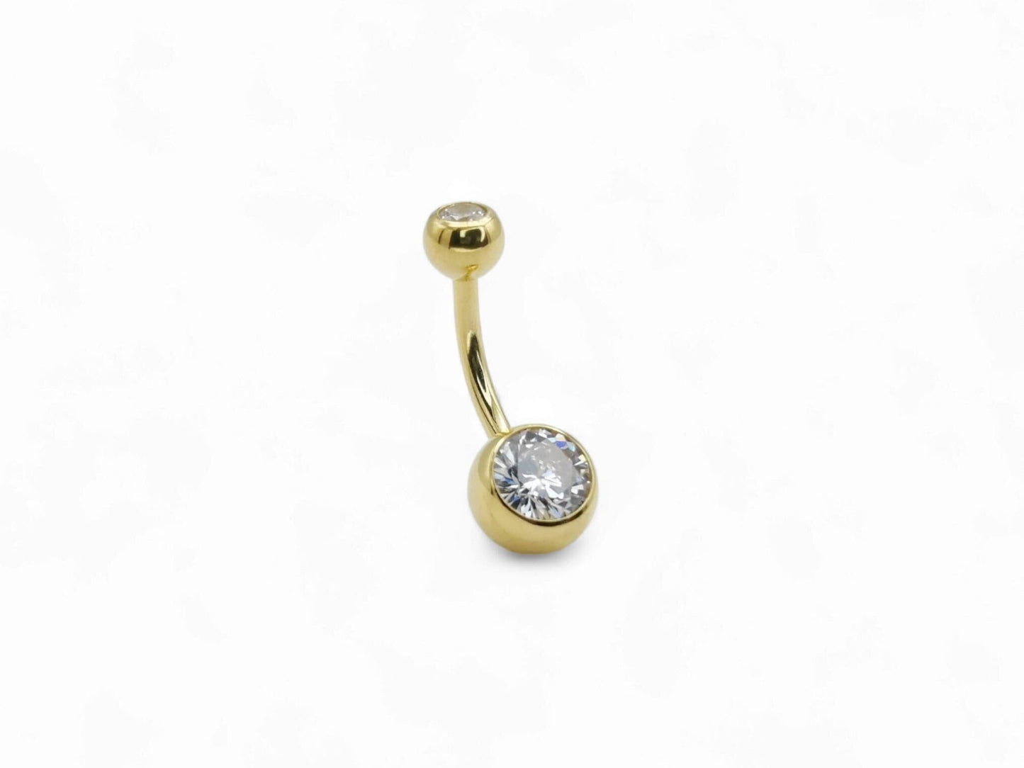 Gold titanium double jewelled navel bar with a white cubic zirconia on a clear background.