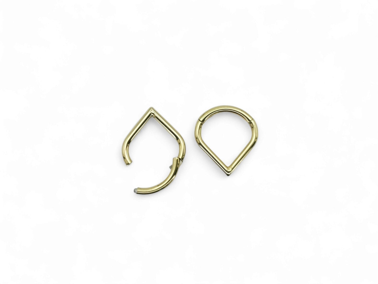 Gold titanium wishbone clicker on a white background