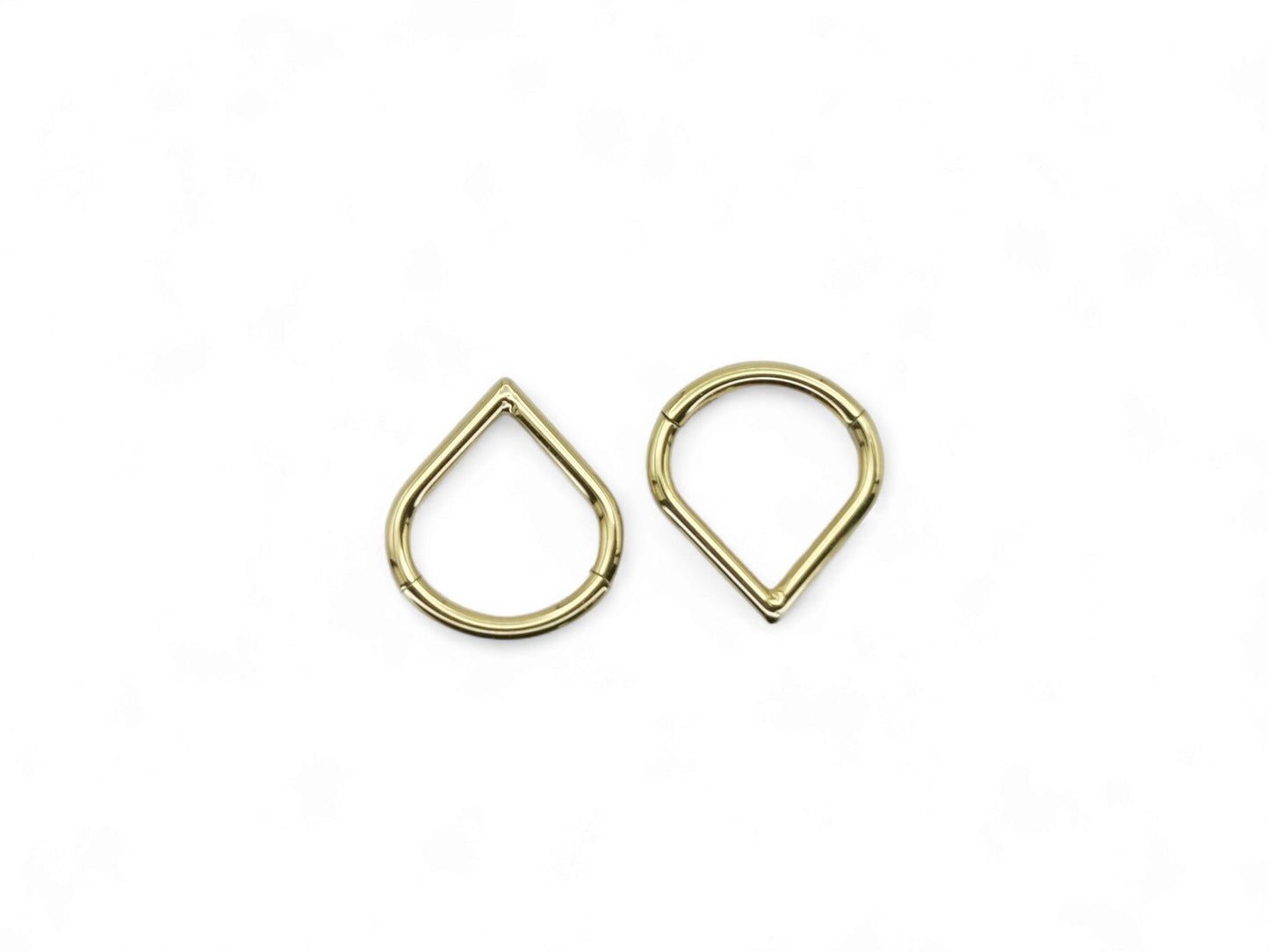 Gold titanium wishbone clicker on a white background