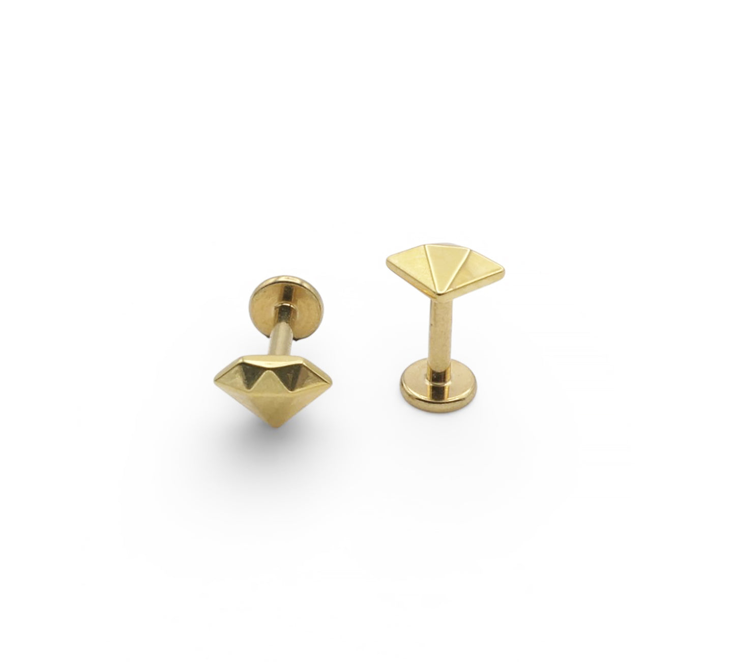 Pair of gold geometric earrings on a white background