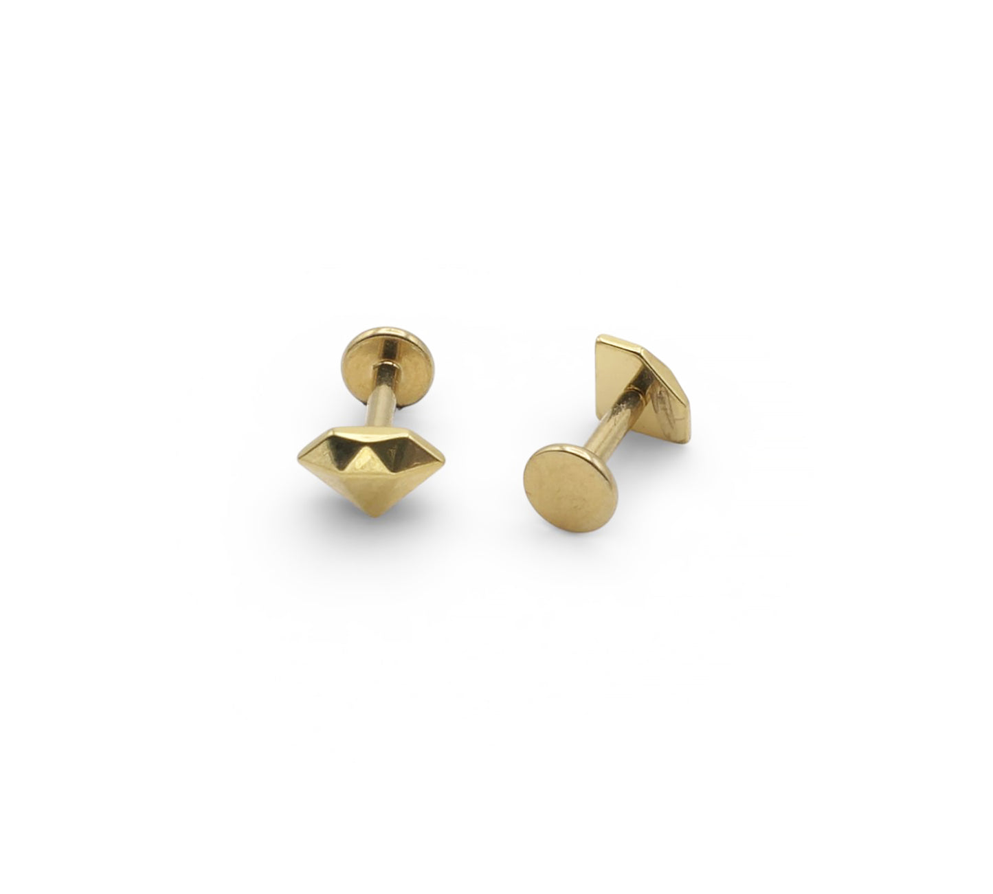 Pair of gold stud earrings on a white background