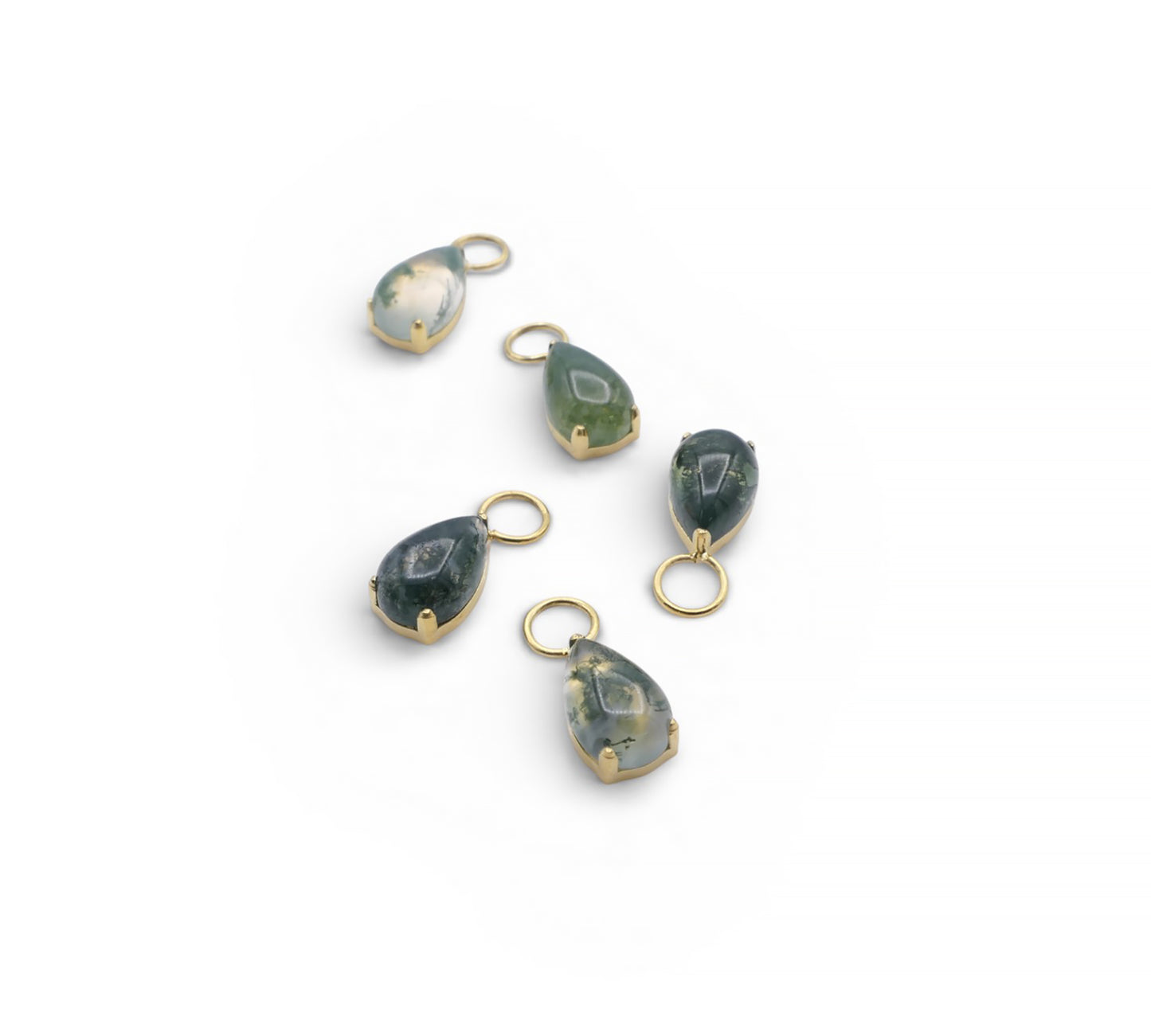 Set of green teardrop pendants with gold loops on a white background