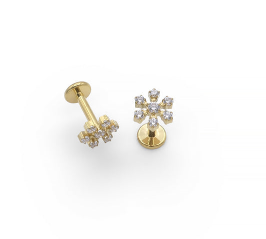 Gold earrings with diamond-like stones on a white background