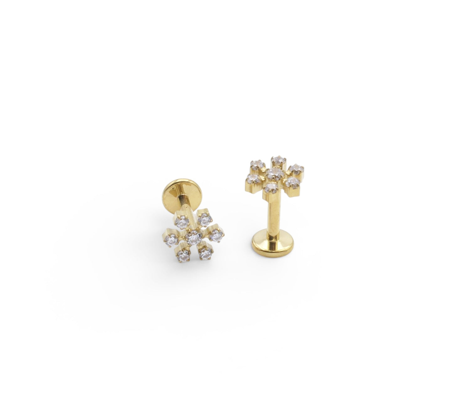 Gold earrings with small diamonds on a white background