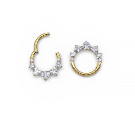 Gold hoop earrings with clear gemstones on a white background
