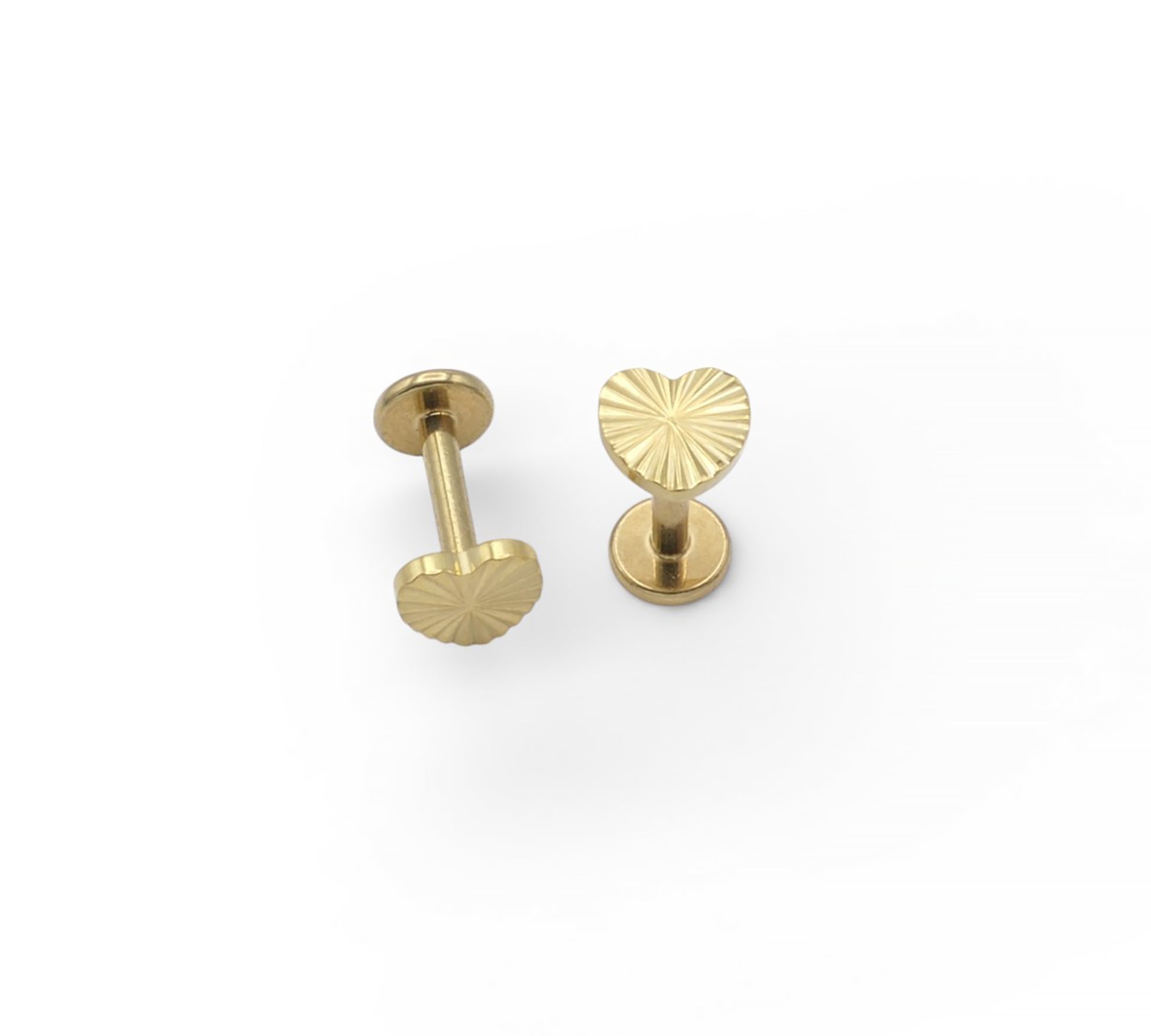 Two gold earrings on a white background
