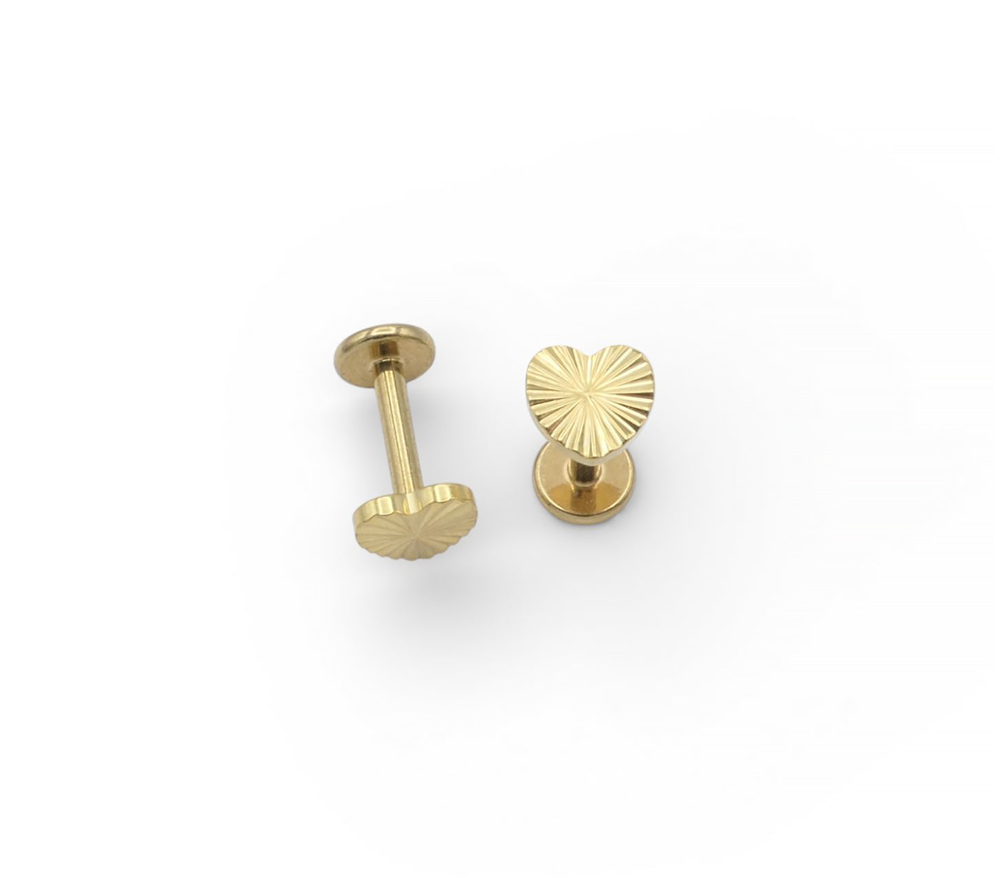 Two gold earrings on a white background