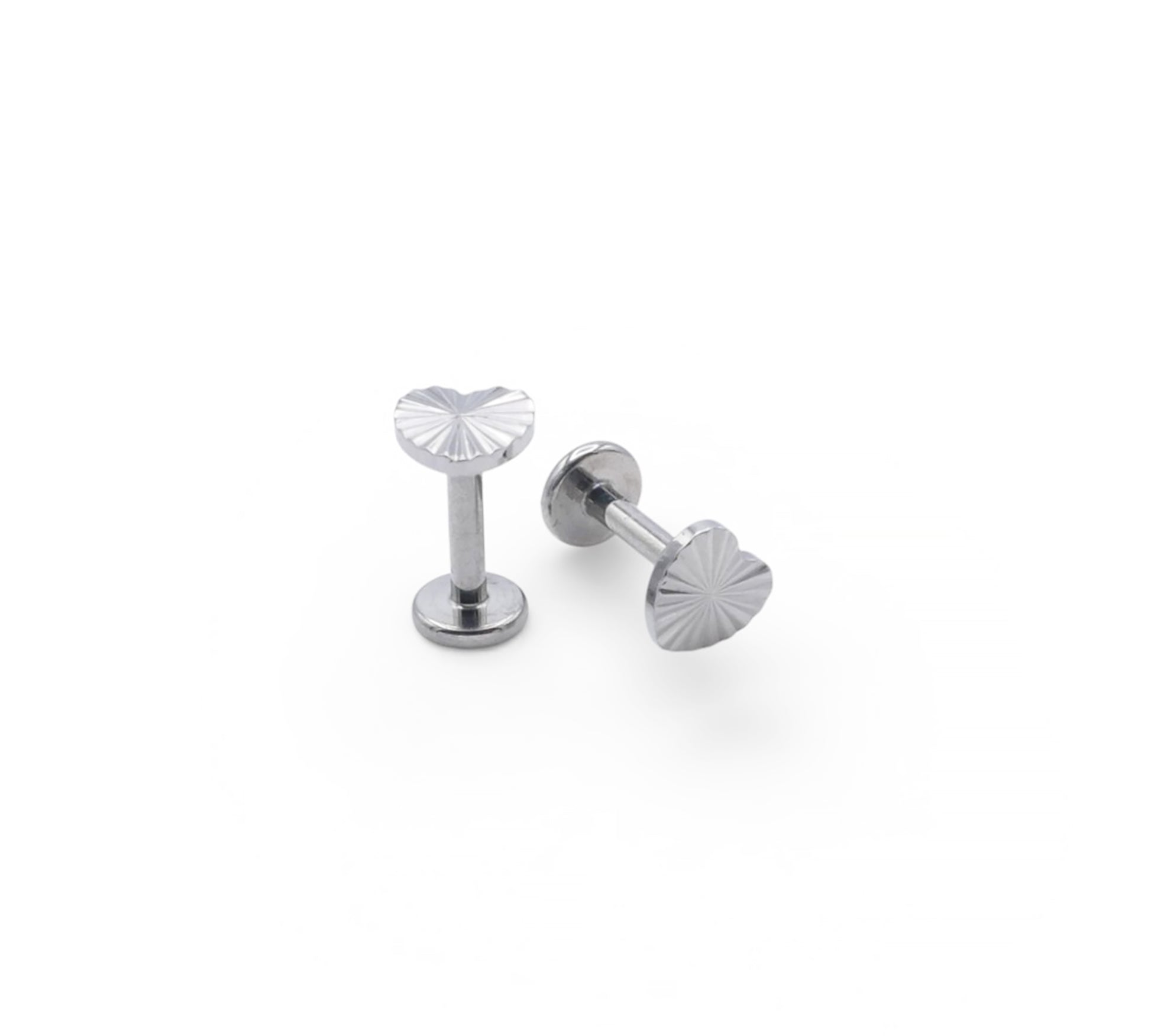 Two silver stud earrings on a white background
