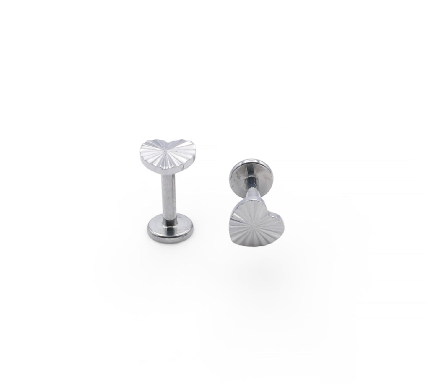 Two silver jewelry components on a white background