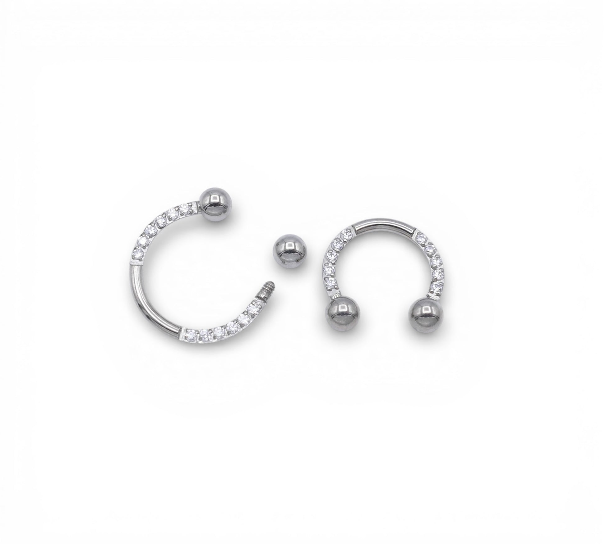 Jewelled circular barbells on a white background