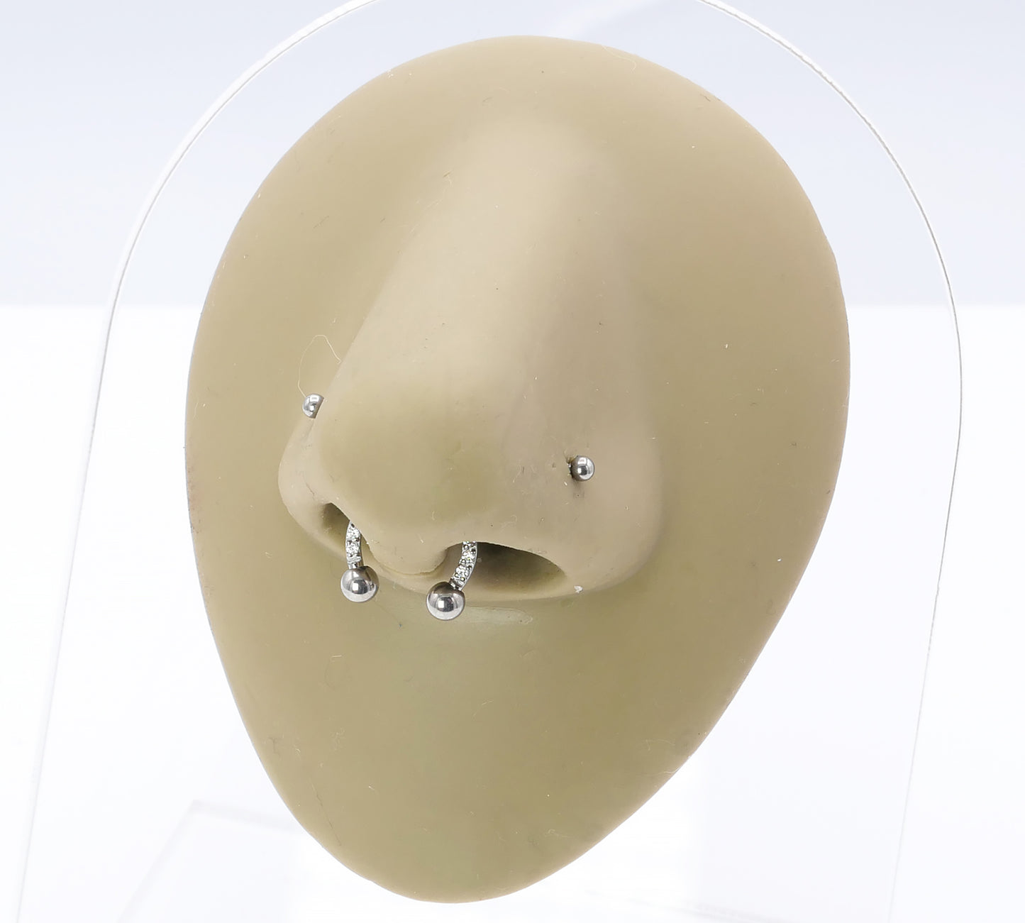 Jewelled circular barbell on a nose model
