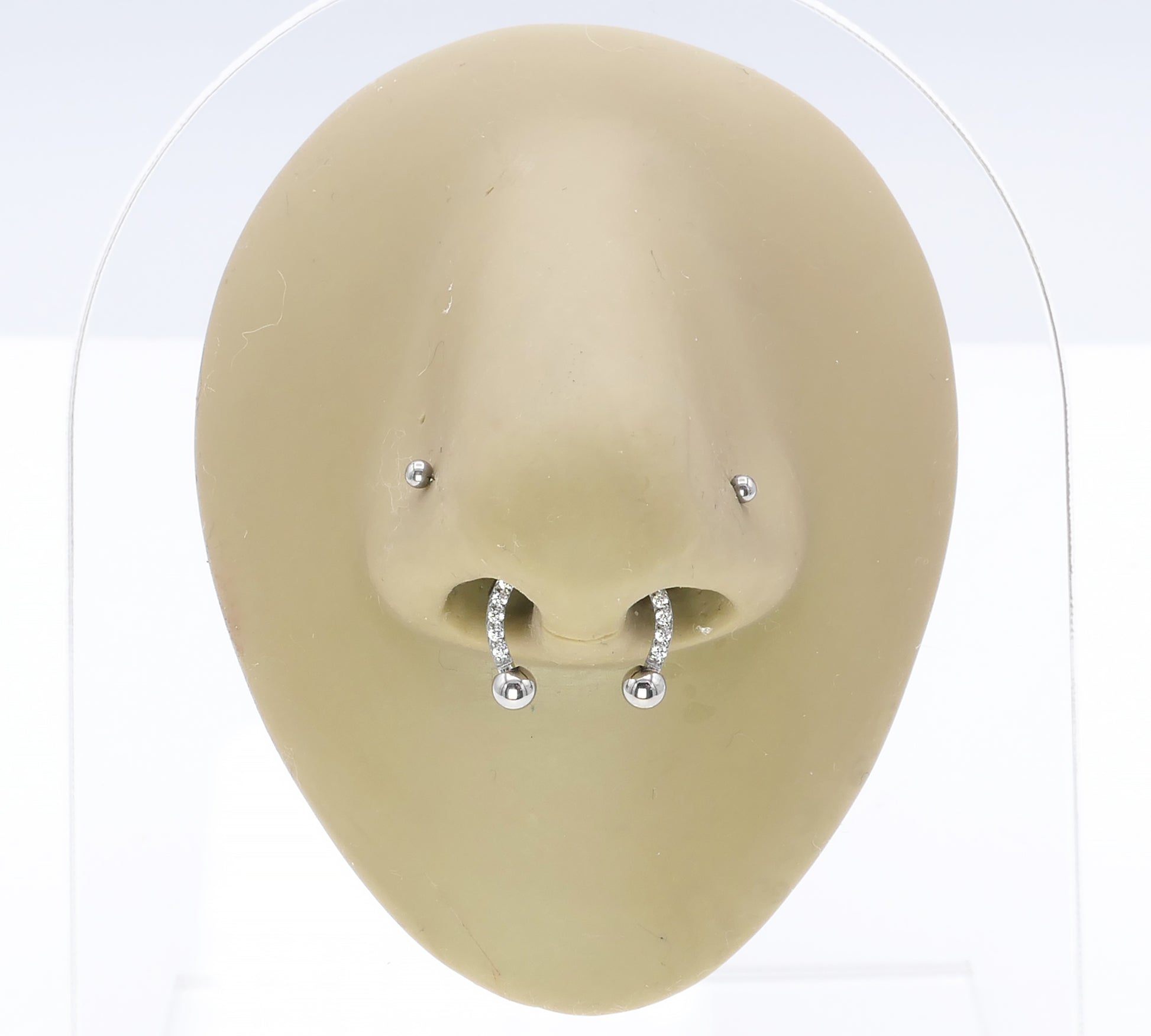 Jewelled circular barbell on a nose model