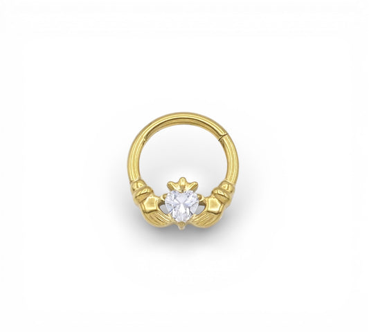 Jewelled Gold Titanium Claddagh Clicker ring on a white background