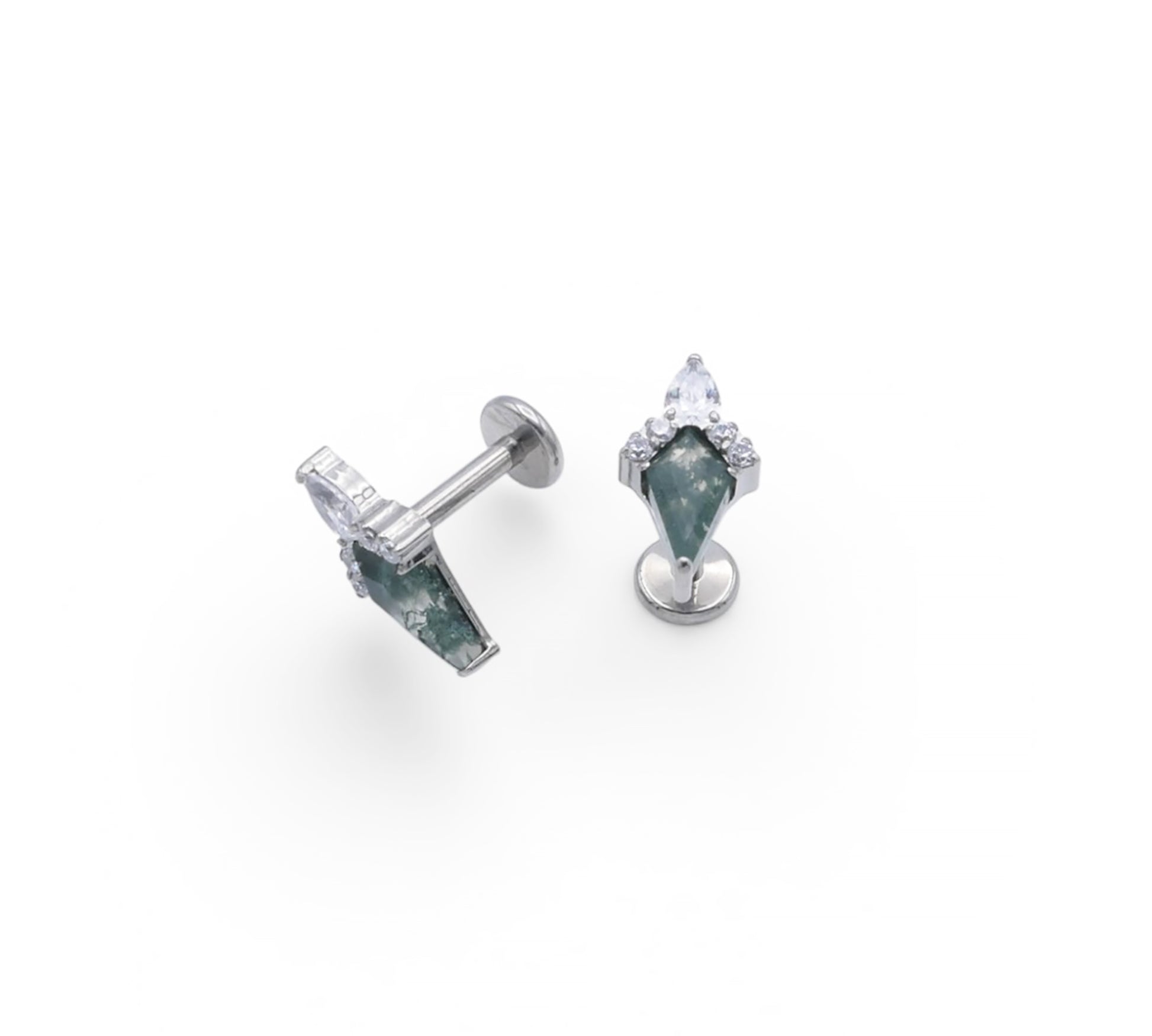 Pair of earrings with green gemstones on a white background