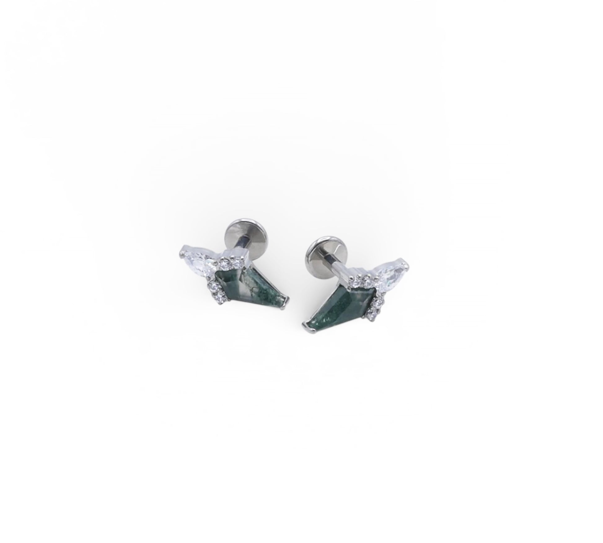 Pair of earrings with green gemstones on a white background