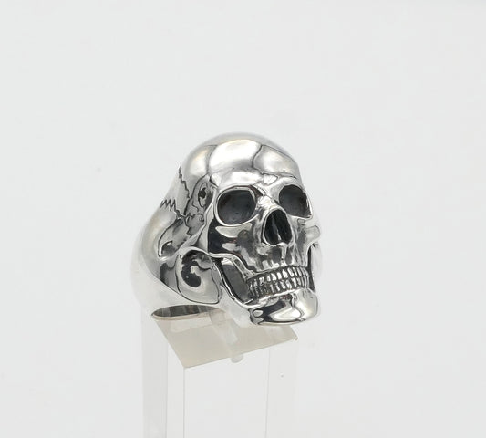 Silver skull ring on a white background