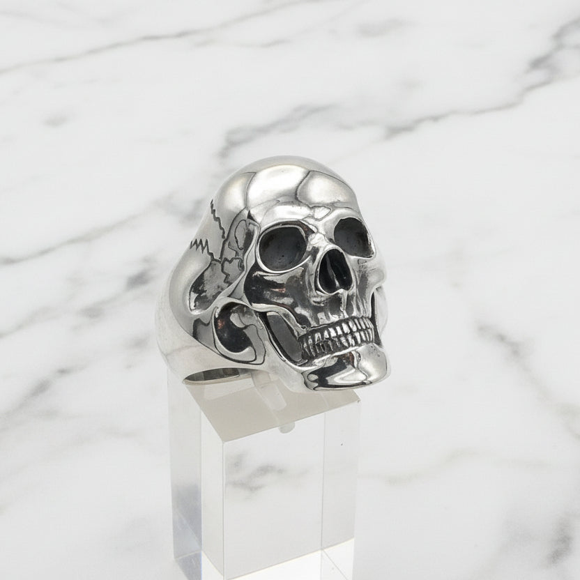 Silver skull ring on a white background