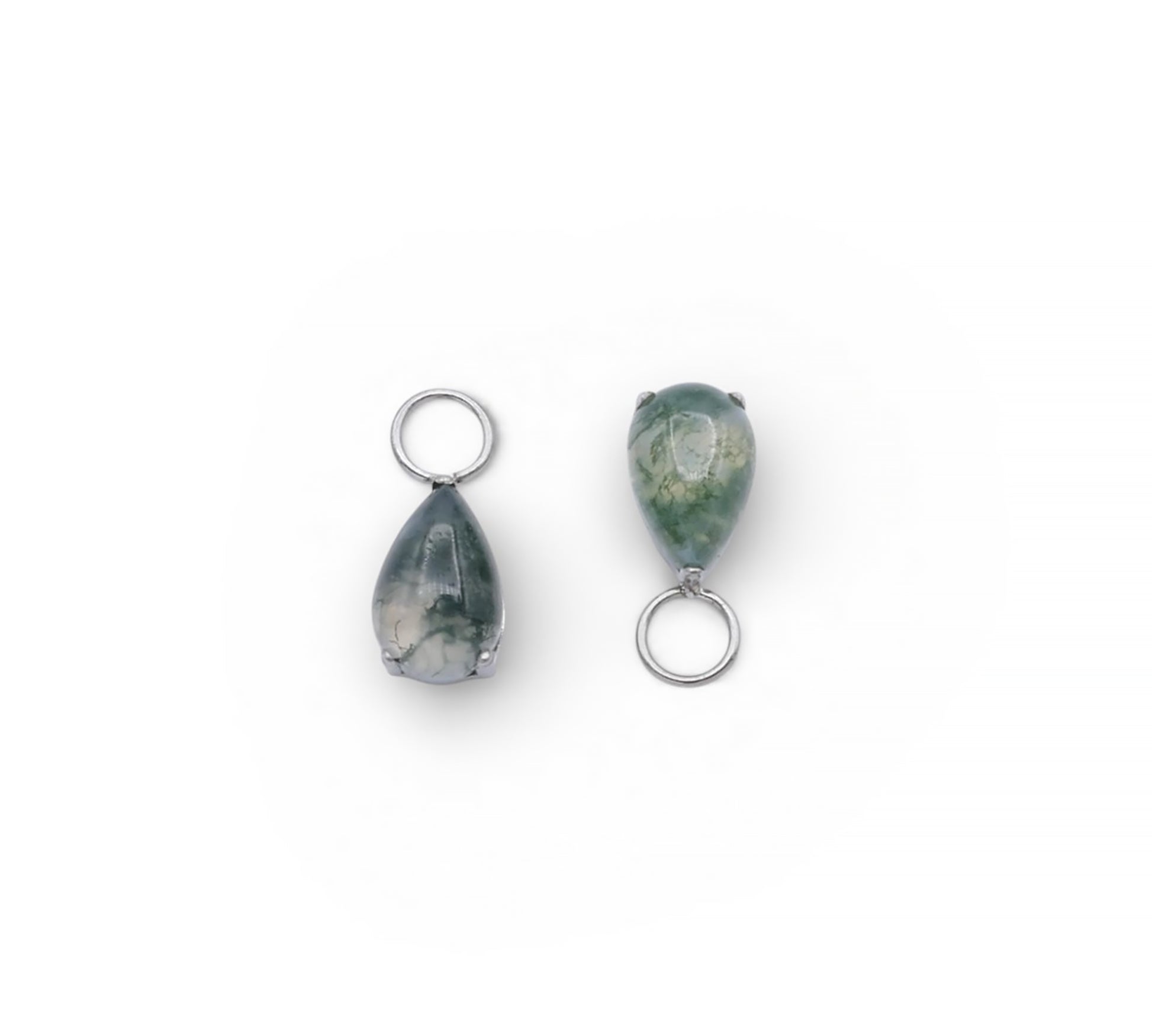 Two teardrop-shaped gemstones with silver loops on a white background