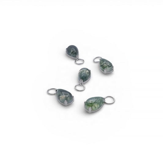 Set of five teardrop-shaped jewelry pendants on a white background