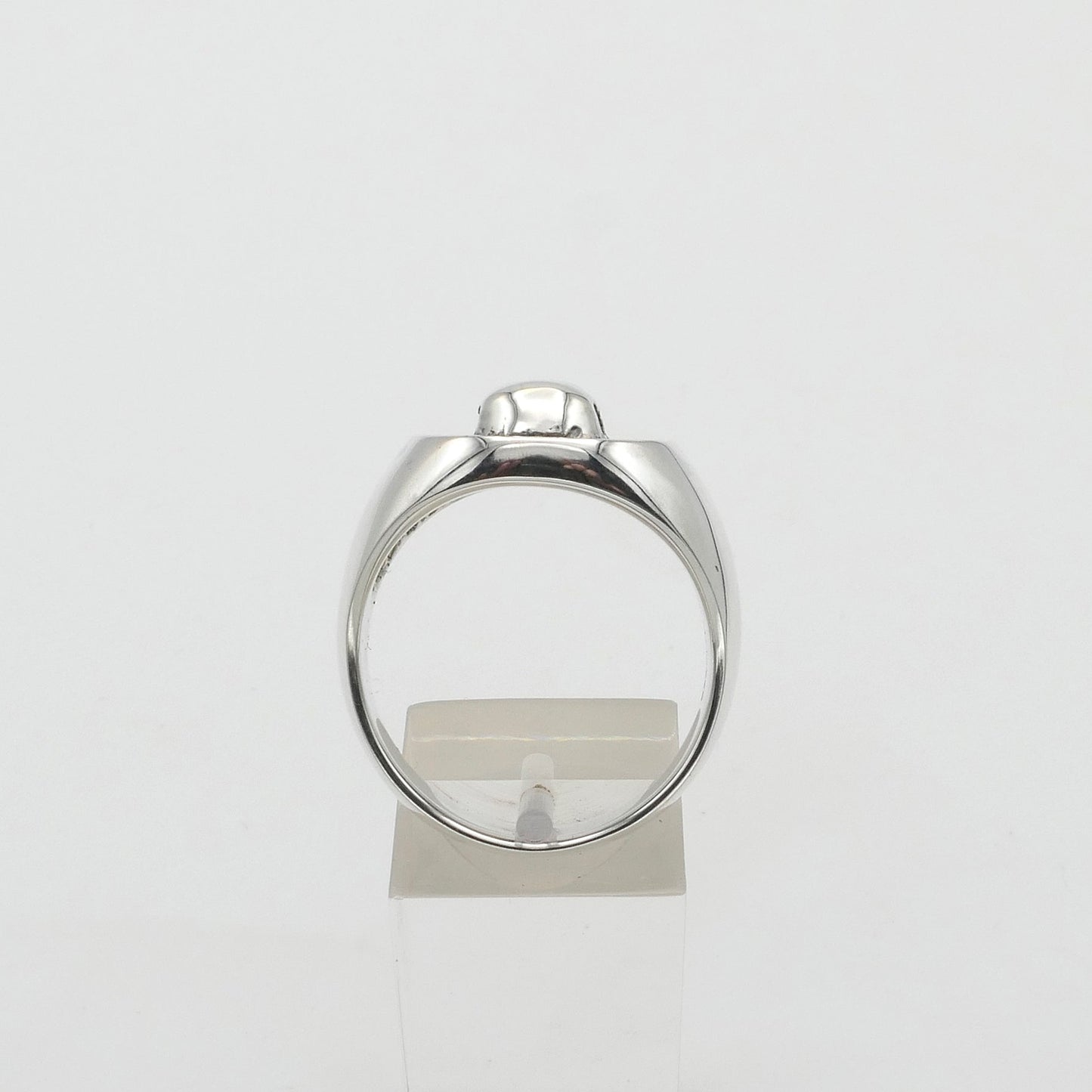 Silver signet ring on a white background