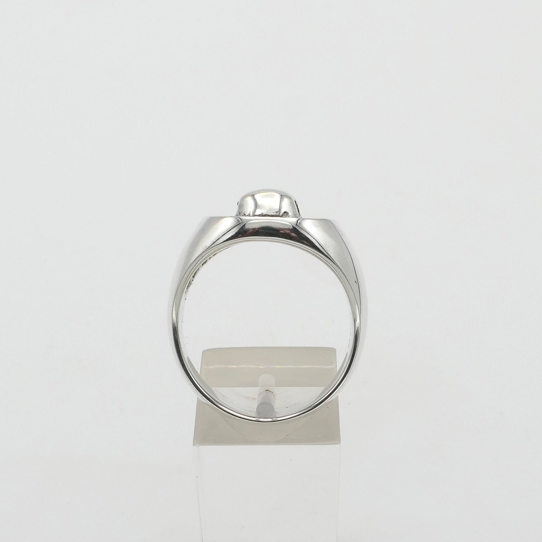 Silver signet ring on a white background