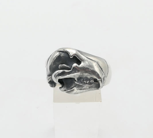 Silver bear skull ring with a unique design on a white background