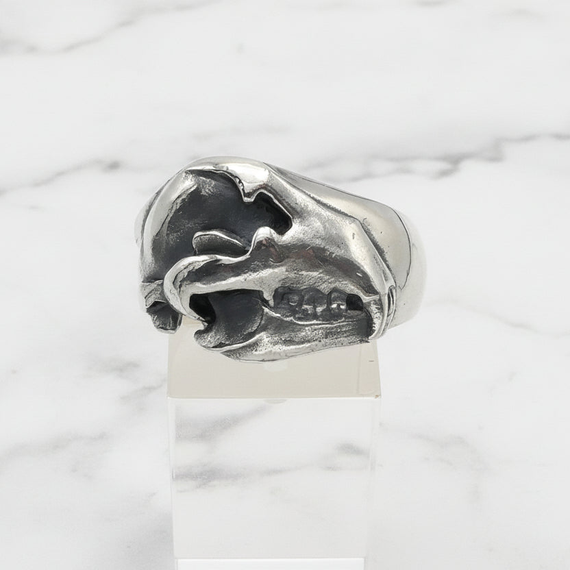 Silver bear skull ring with a unique design on a white background