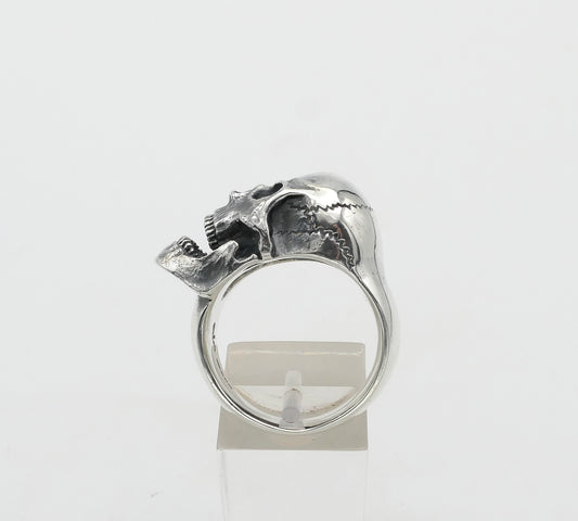 Silver skull ring with a unique design on a white background