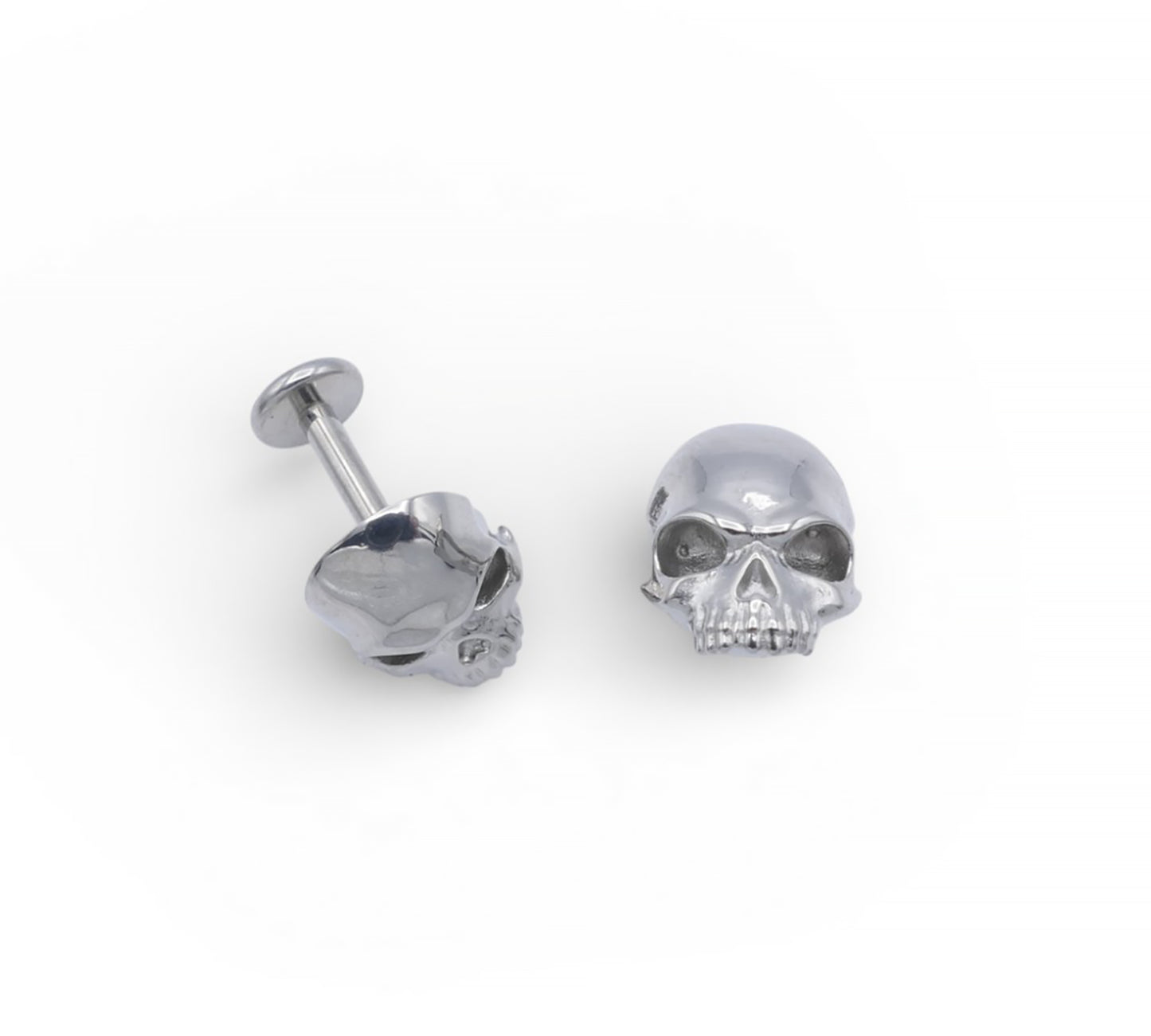 Skull-shaped earrings on a white background