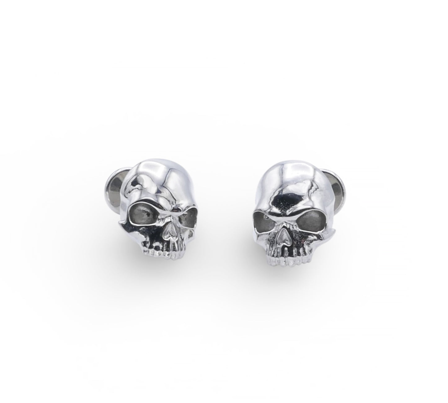Pair of silver skull-shaped earrings on a white background