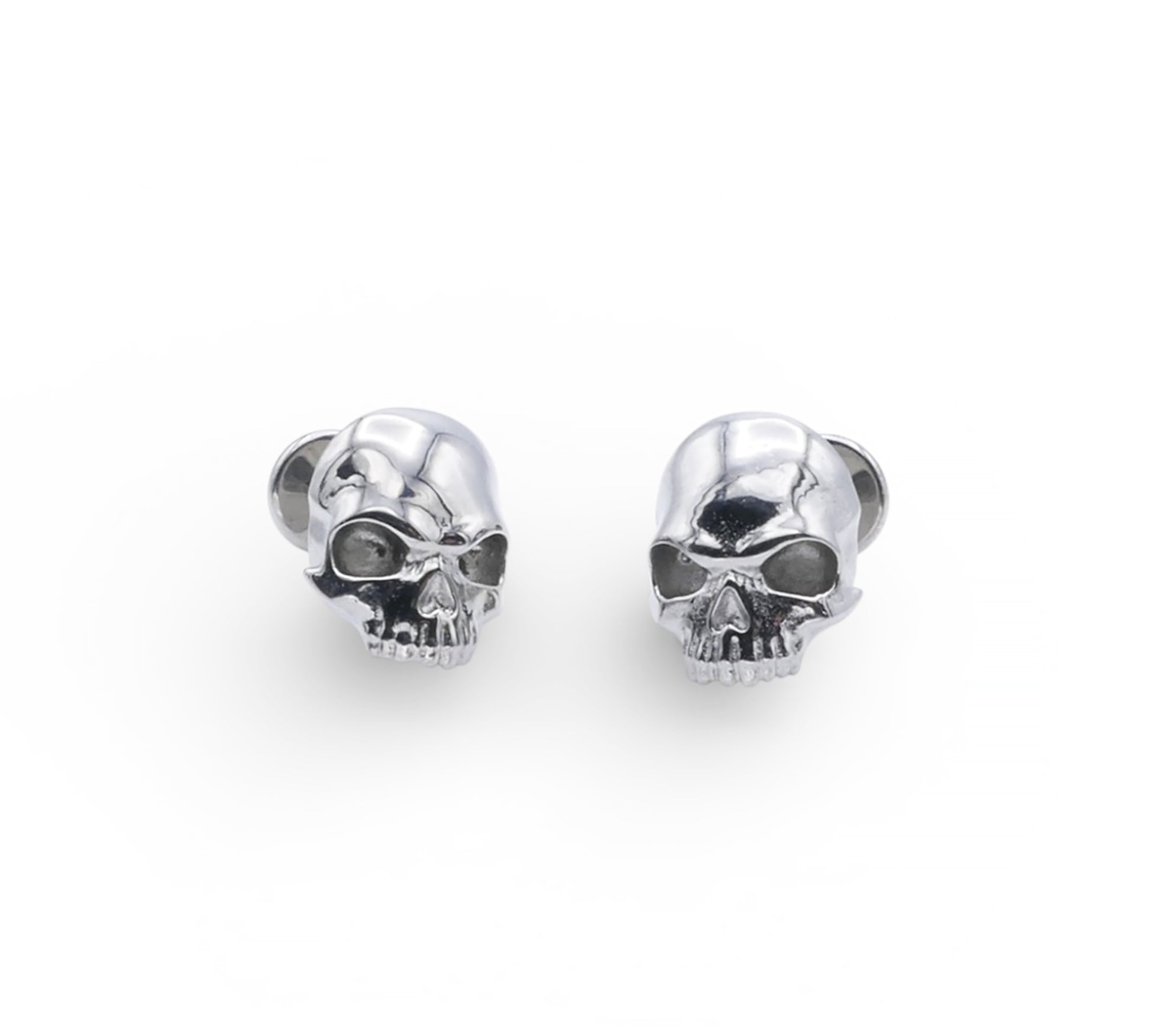 Pair of silver skull-shaped earrings on a white background