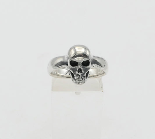 Silver skull ring on a white background