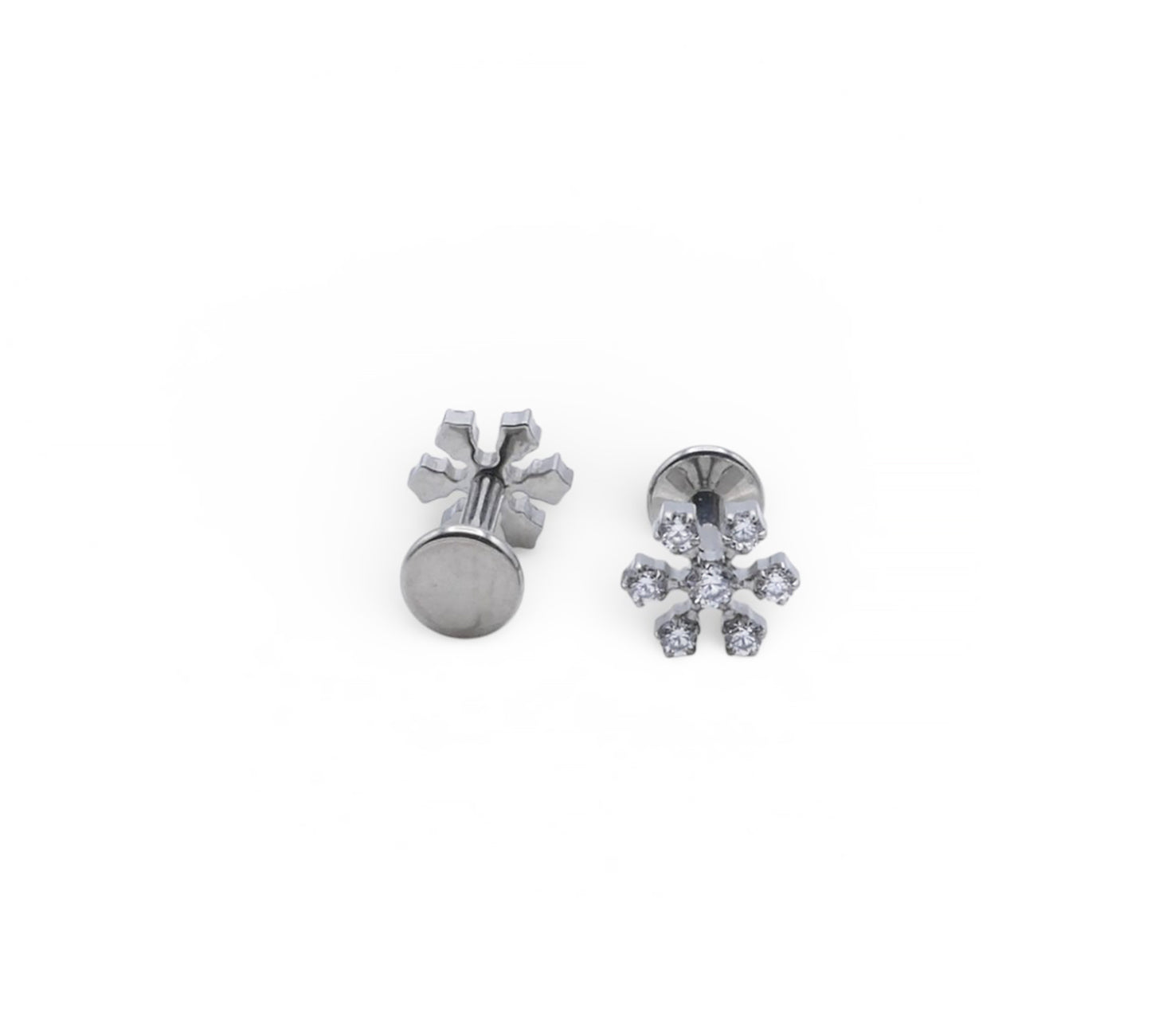 Pair of silver snowflake earrings on a white background