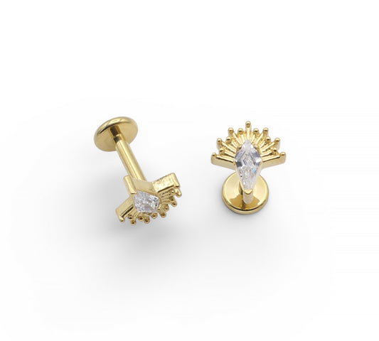 Gold earrings with clear gemstones on a white background